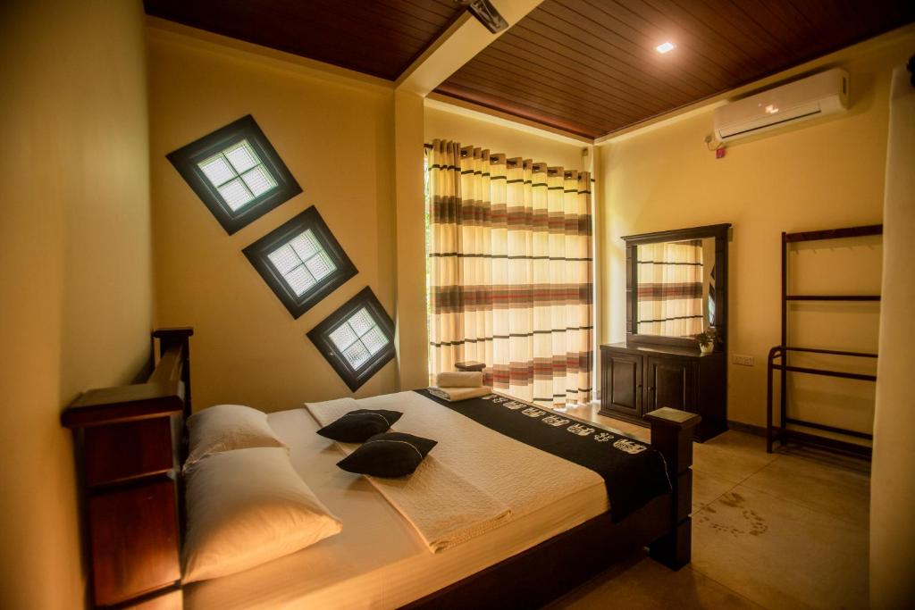 Postel nebo postele na pokoji v ubytování Evergreen Hotel Dambulla