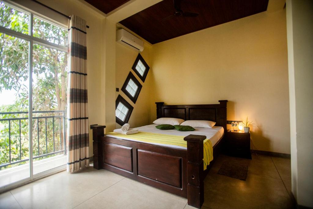 Postel nebo postele na pokoji v ubytování Evergreen Hotel Dambulla