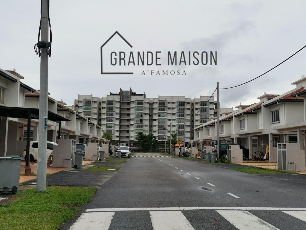 an empty street in front of a large building at GRANDE MAISON HOMES 2 A'Famosa Golf view Near WATERPARK l UITM l HONDA l Netflix l Self Check in in Kampong Alor Gajah