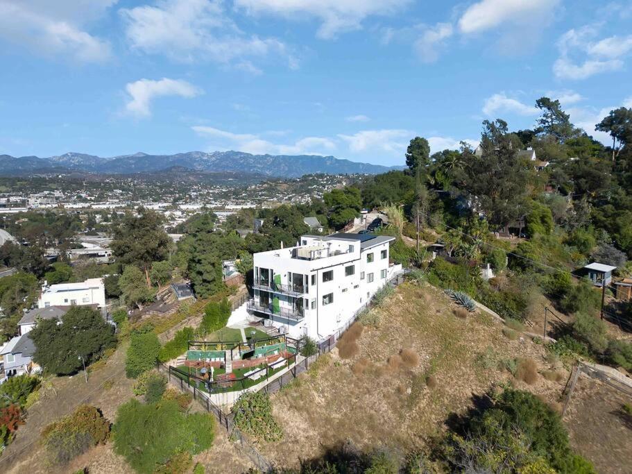 an aerial view of a white house on a hill at Mesmerizing Villa. Perfect for group retreats in Los Angeles