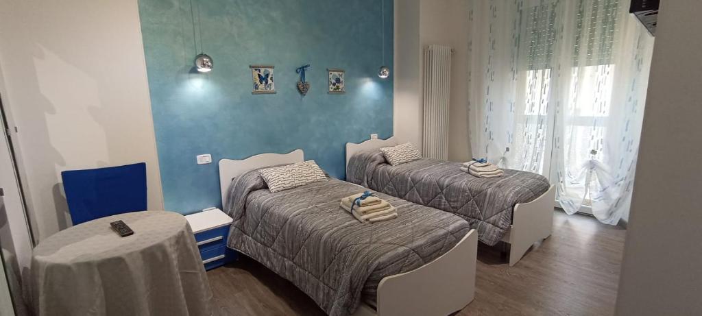 A bed or beds in a room at La Casa di Mà