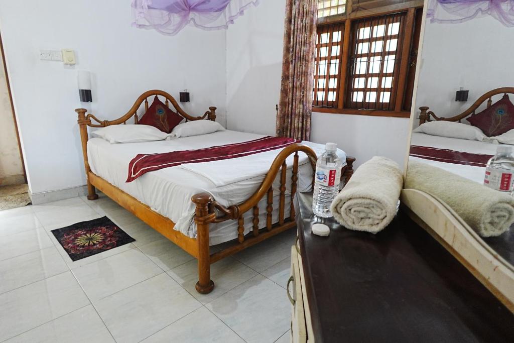 Postel nebo postele na pokoji v ubytování Suisse View Residence Kandy