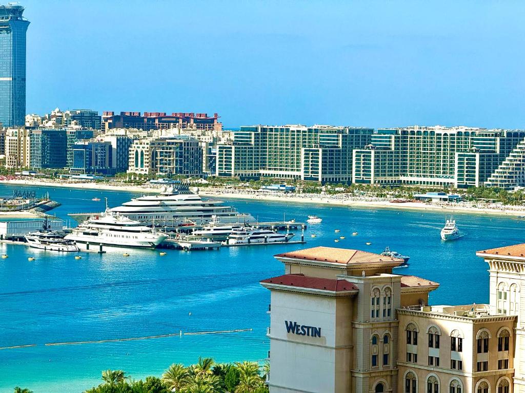 a view of a city with boats in the water at Marina Bliss: Stunning Views, By Marina Walk & JBR in Dubai