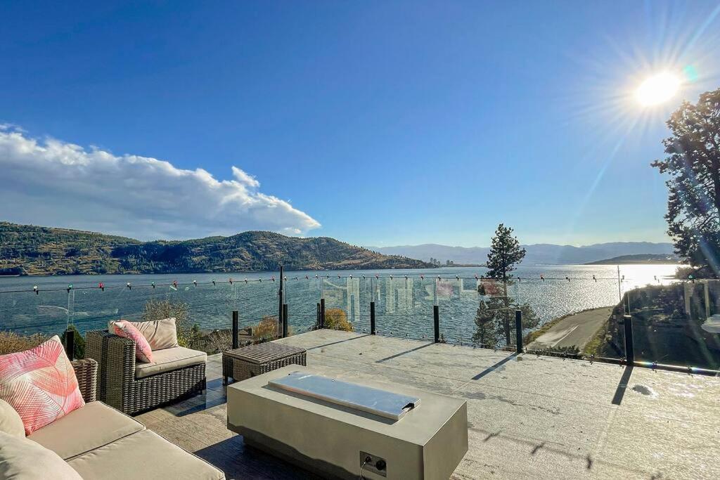 a living room with a view of a body of water at Short Term Rental Approved. Stay Worry Free! in Kelowna