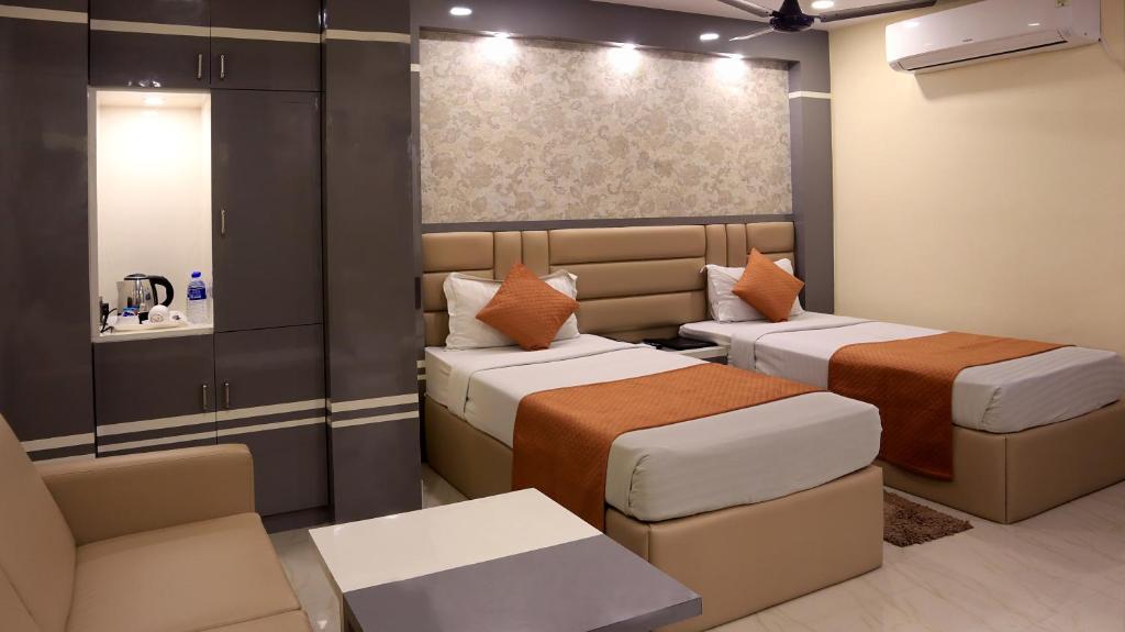 Postel nebo postele na pokoji v ubytování Hotel Executive Tower