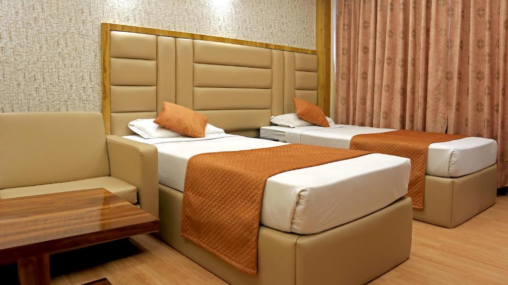 Postel nebo postele na pokoji v ubytování Hotel Executive Tower