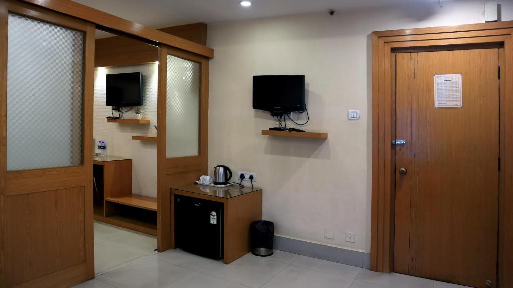 TV a/nebo společenská místnost v ubytování Hotel Executive Tower