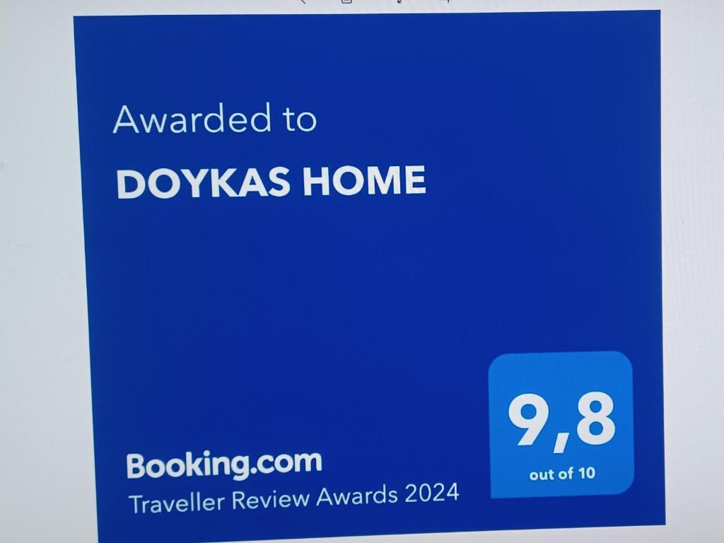 a blue sign that says awarded to doxalis home at Doukas Home in Mytilini