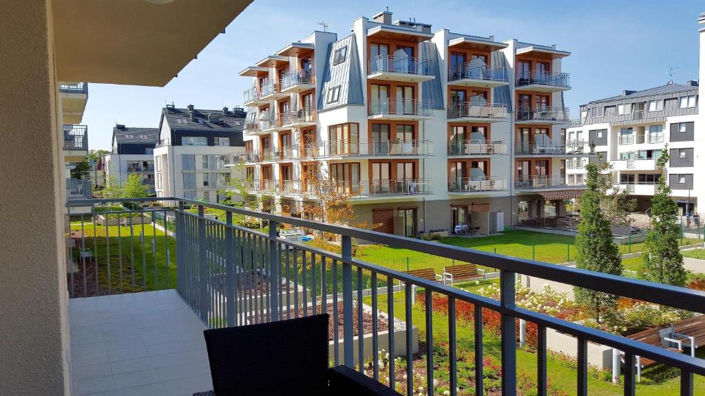 a view of a building from a balcony at Four Seasons Aquamarina in Świnoujście