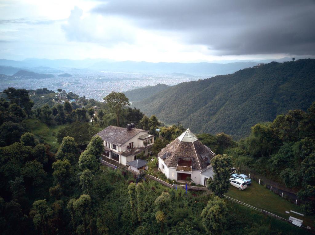 an aerial view of a house in the mountains at Brookside Villa Pokhara in Pokhara