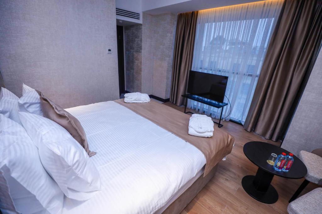 Postel nebo postele na pokoji v ubytování Arium Hotel Baku