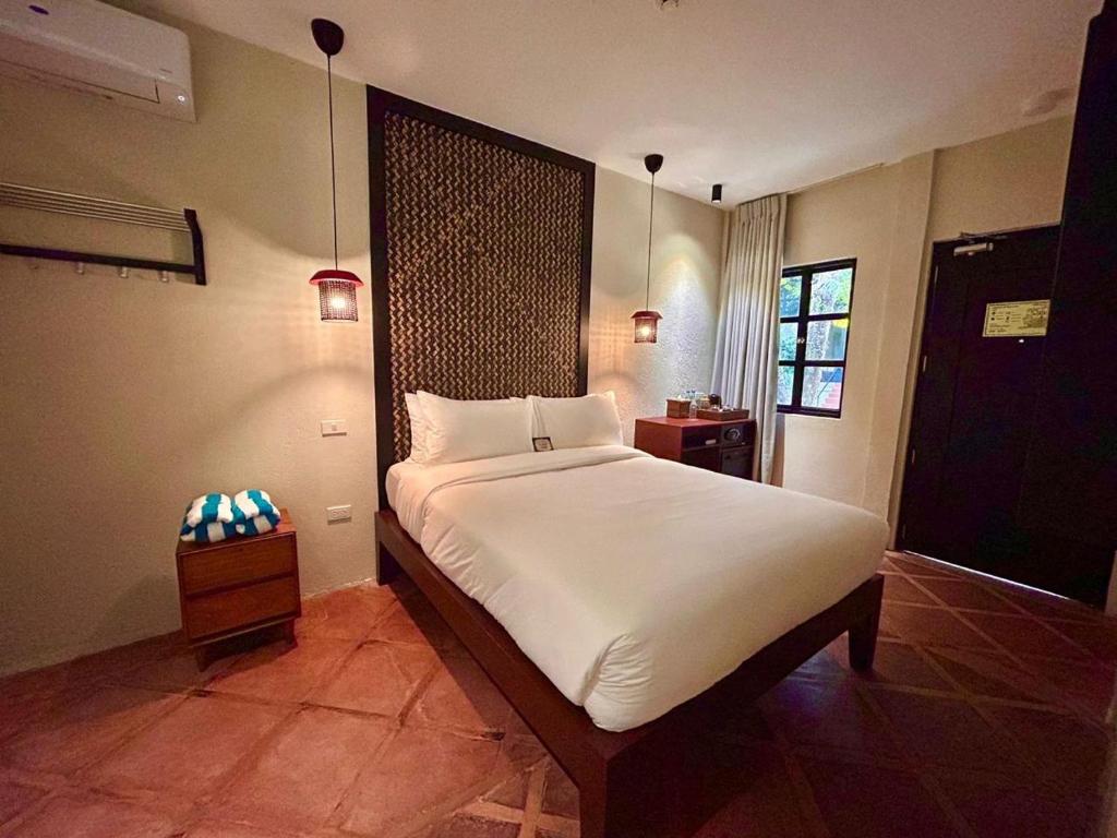 Postel nebo postele na pokoji v ubytování The Henry Resort Boracay