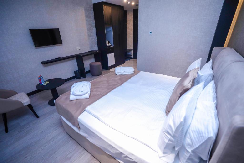 Postel nebo postele na pokoji v ubytování Arium Hotel Baku
