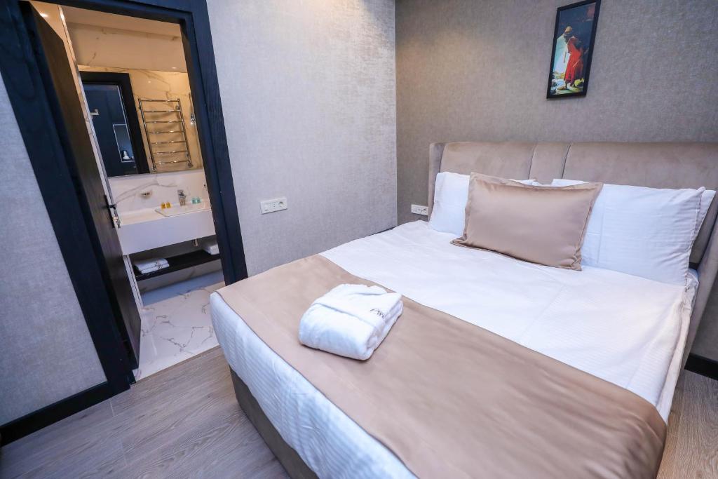 Postel nebo postele na pokoji v ubytování Arium Hotel Baku