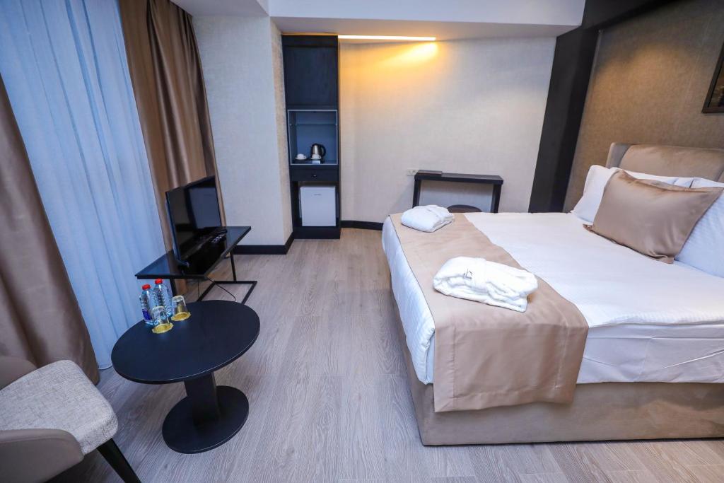 Postel nebo postele na pokoji v ubytování Arium Hotel Baku