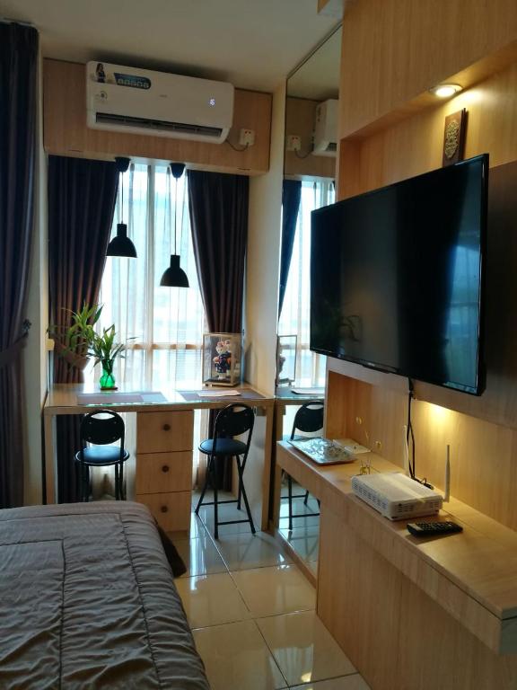 TV a/nebo společenská místnost v ubytování Studio Pleasant Tifolia