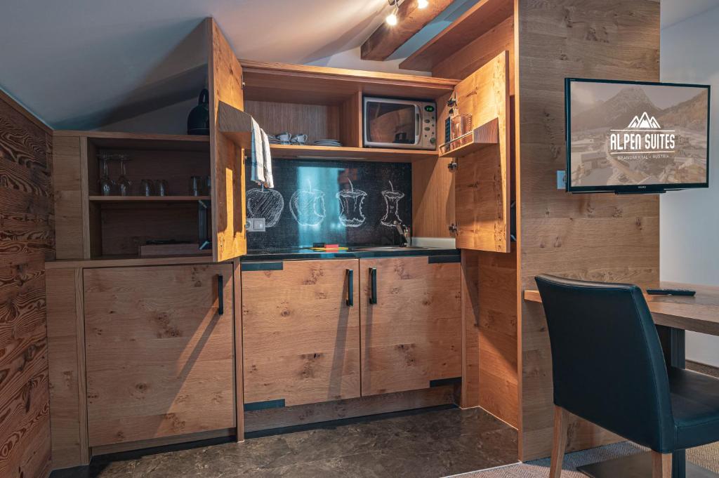 Kuchyň nebo kuchyňský kout v ubytování Alpen Suites Brandnertal