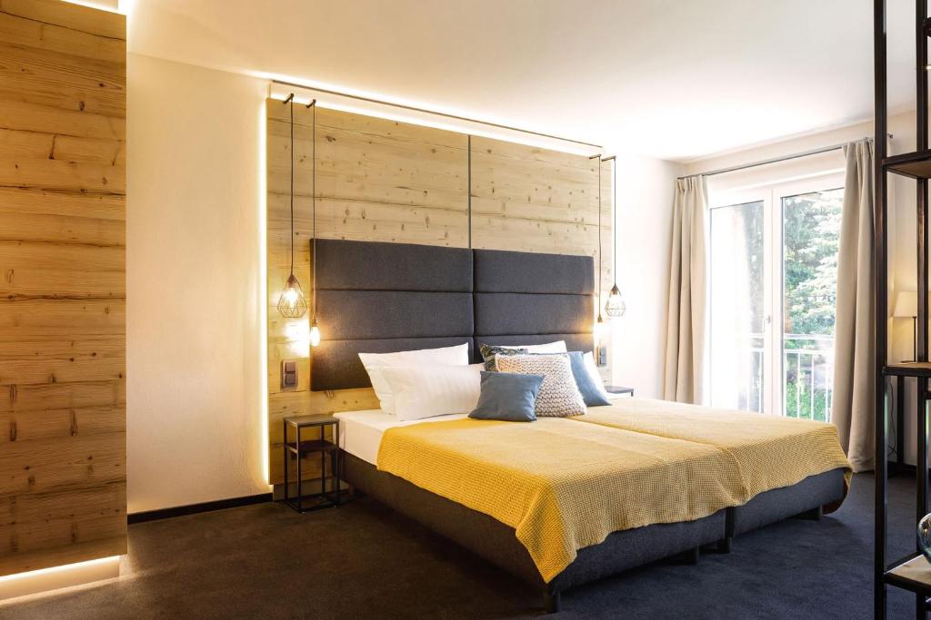 Postel nebo postele na pokoji v ubytování Hotel Wilhelmshöhe Auderath