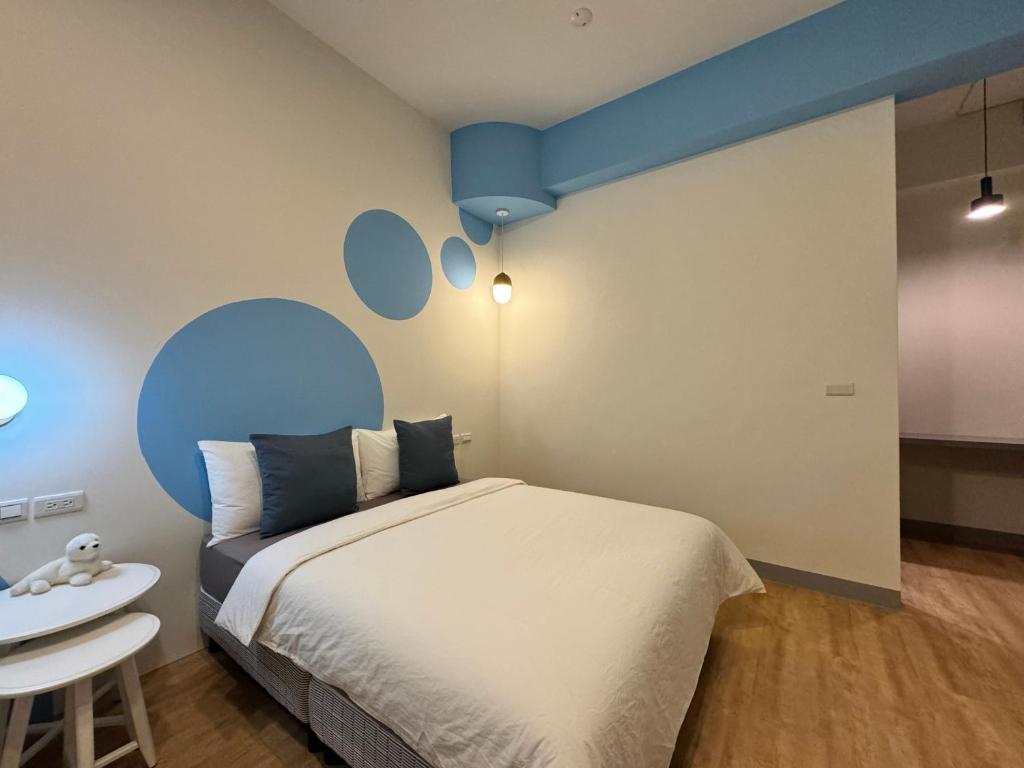 Postel nebo postele na pokoji v ubytování WinXin House