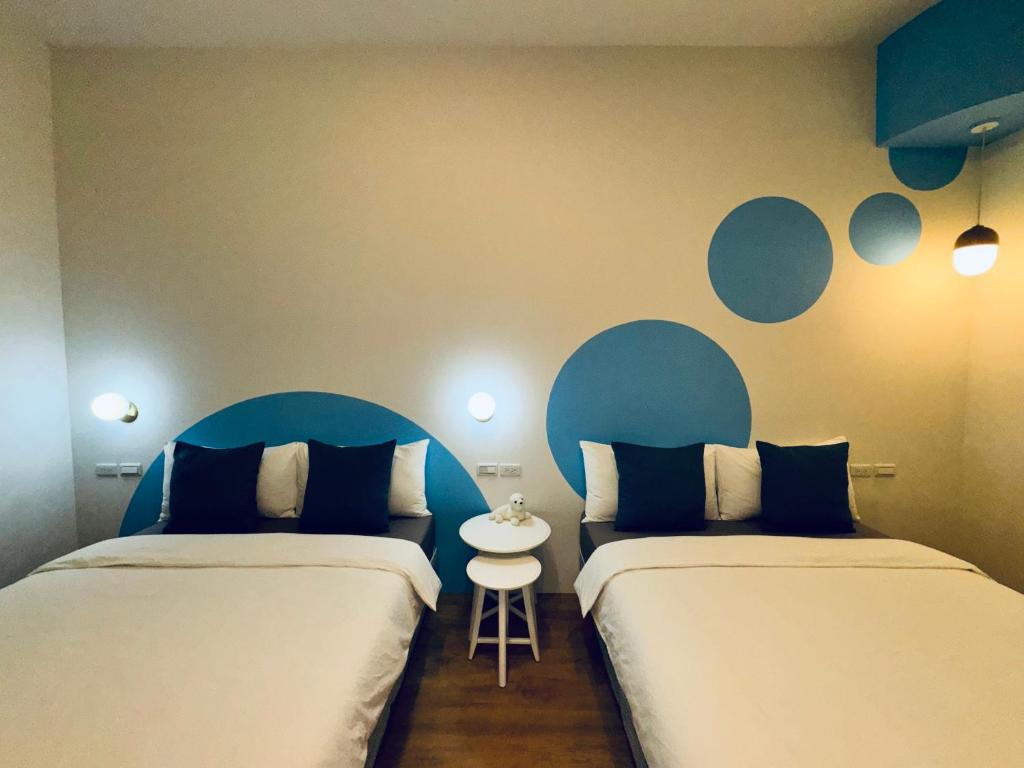 Postel nebo postele na pokoji v ubytování WinXin House