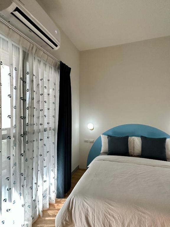 Postel nebo postele na pokoji v ubytování WinXin House