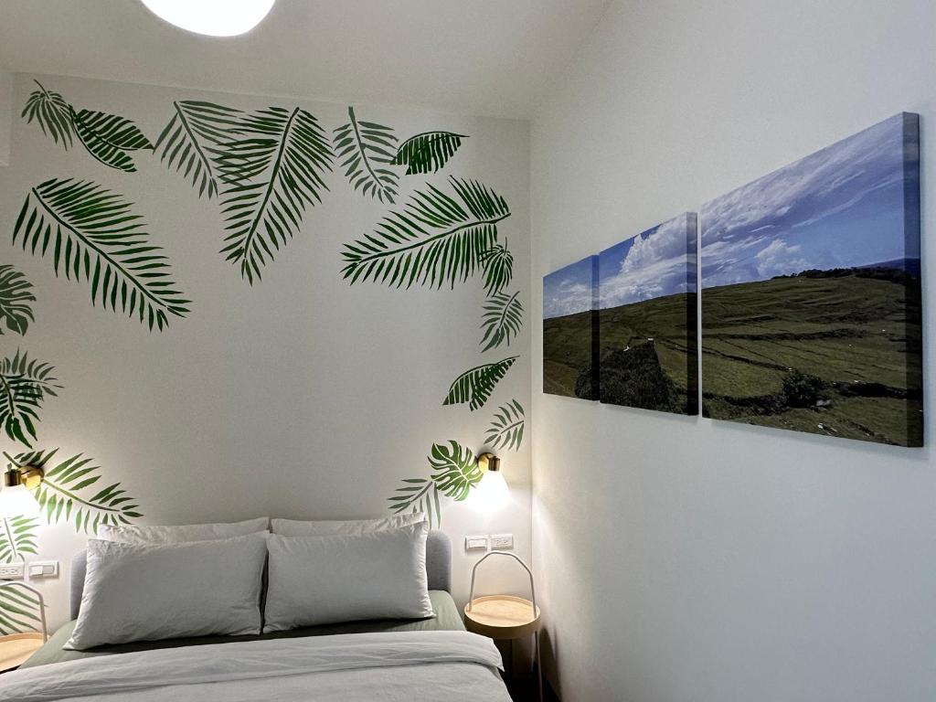Postel nebo postele na pokoji v ubytování WinXin House