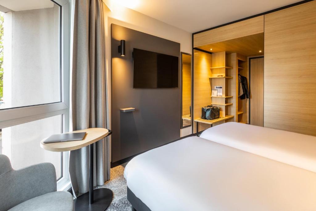Postel nebo postele na pokoji v ubytování ibis Nancy Centre Stanislas