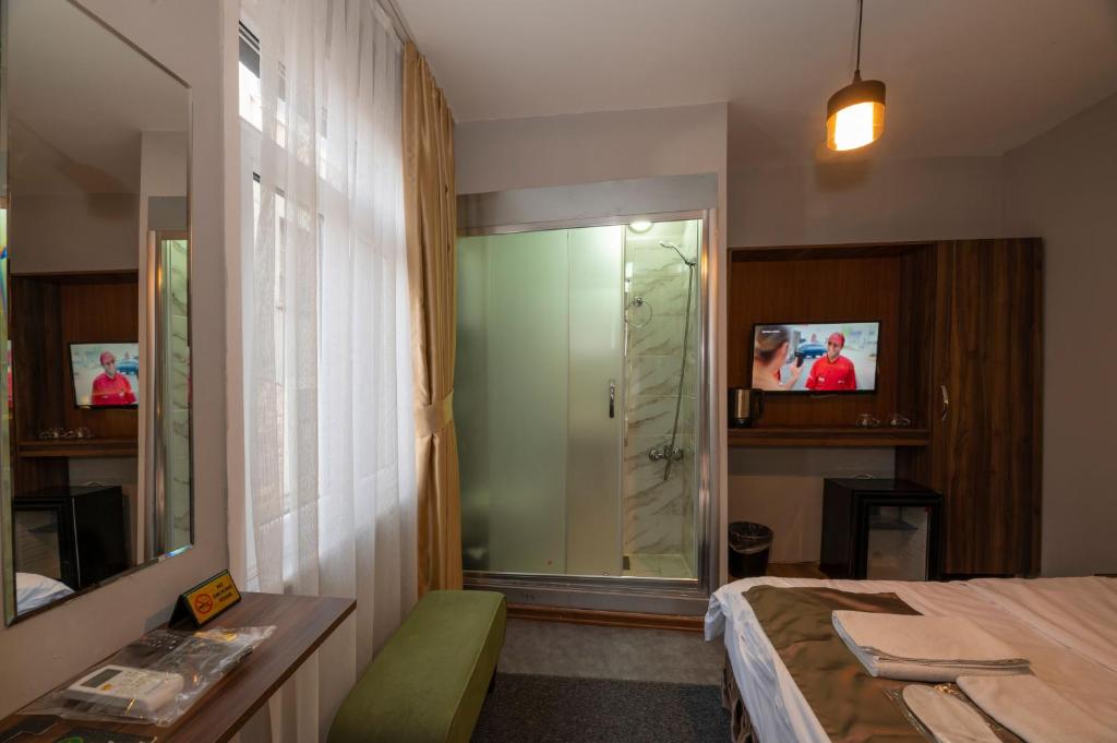 A television and/or entertainment centre at Boutique Central Taksim