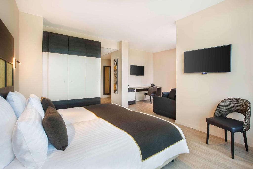 Postel nebo postele na pokoji v ubytování Best Western Plus Hôtel Escapade Senlis