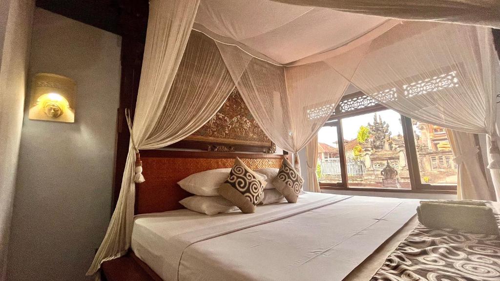 Postel nebo postele na pokoji v ubytování Bali Moon Guest House