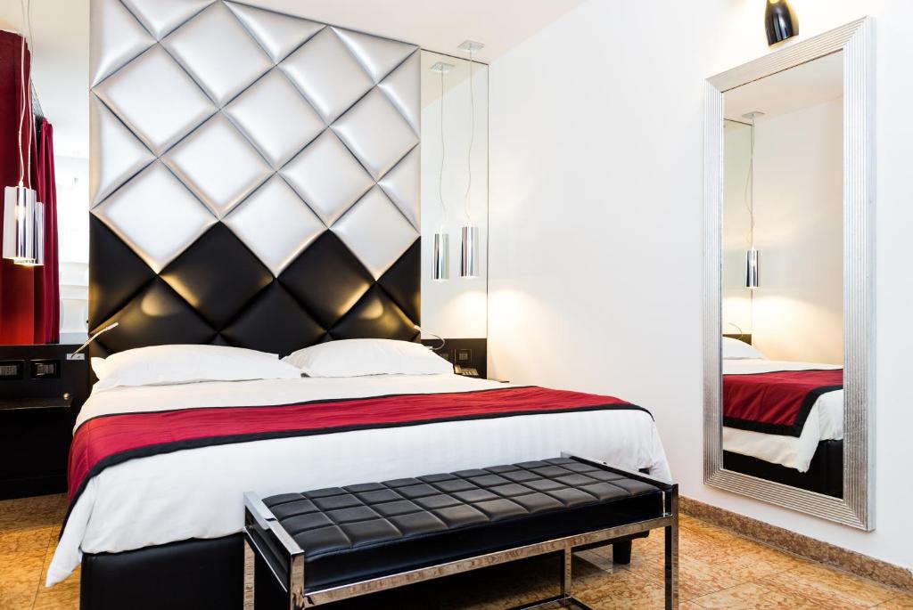 Postel nebo postele na pokoji v ubytování Corte Ongaro Hotel