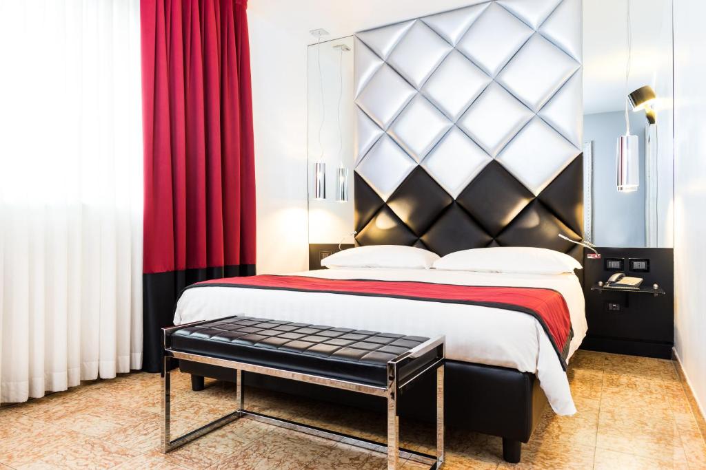 Postel nebo postele na pokoji v ubytování Corte Ongaro Hotel