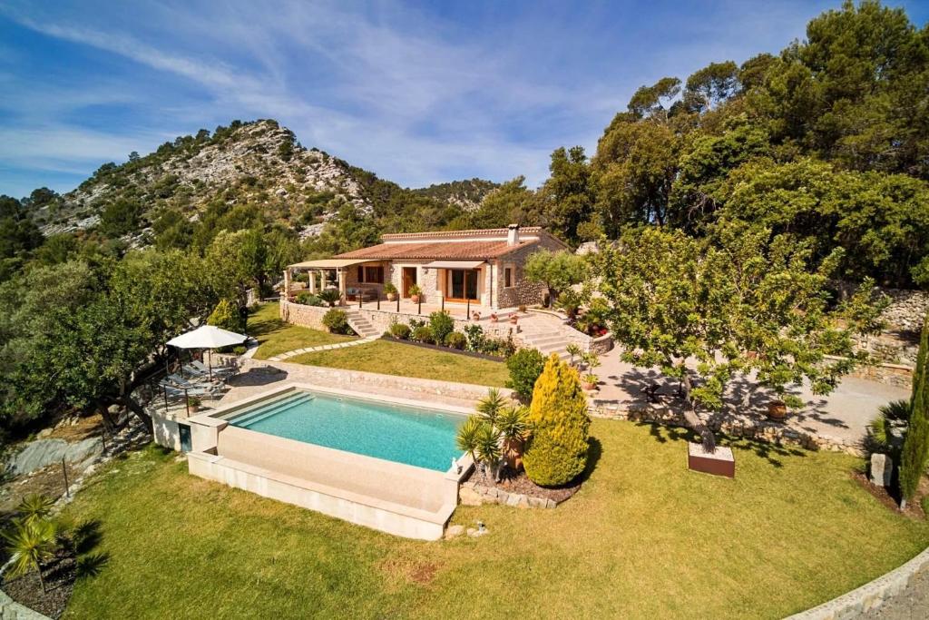 an aerial view of a house with a swimming pool at La Salve dalt in Pollença