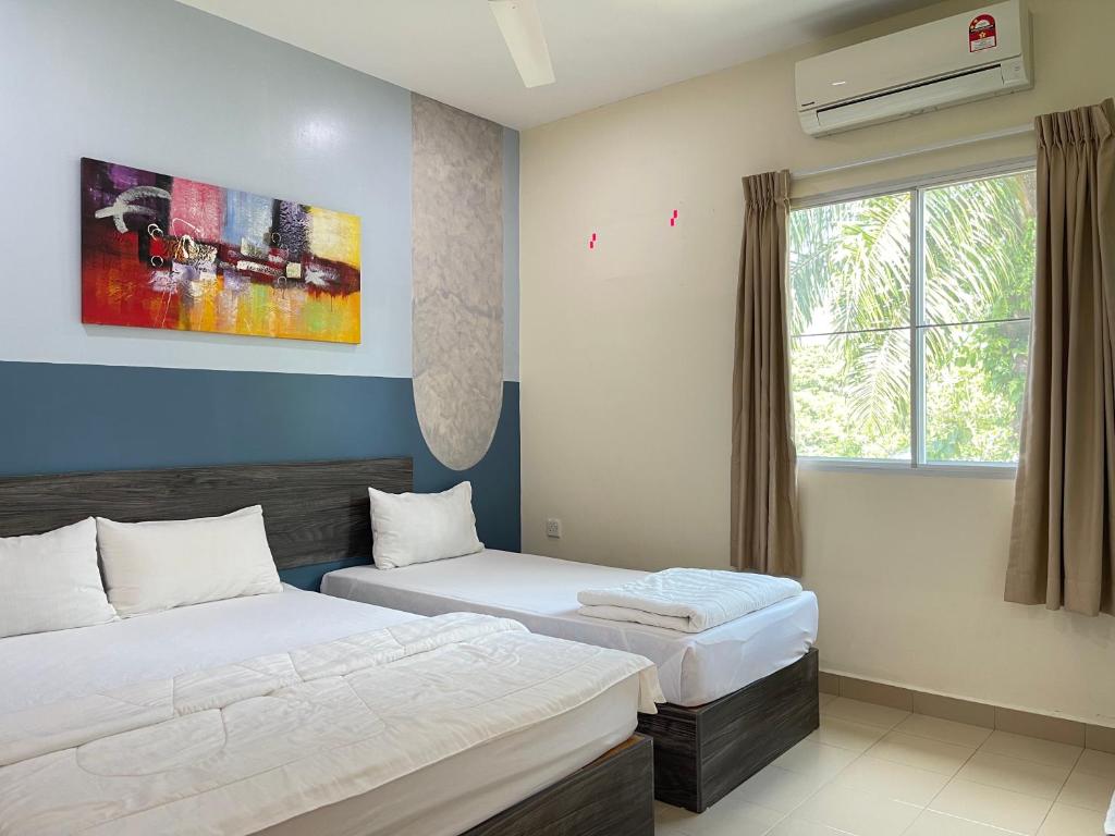 Postel nebo postele na pokoji v ubytování MR Homestay HotelStyle Room Teluk Intan