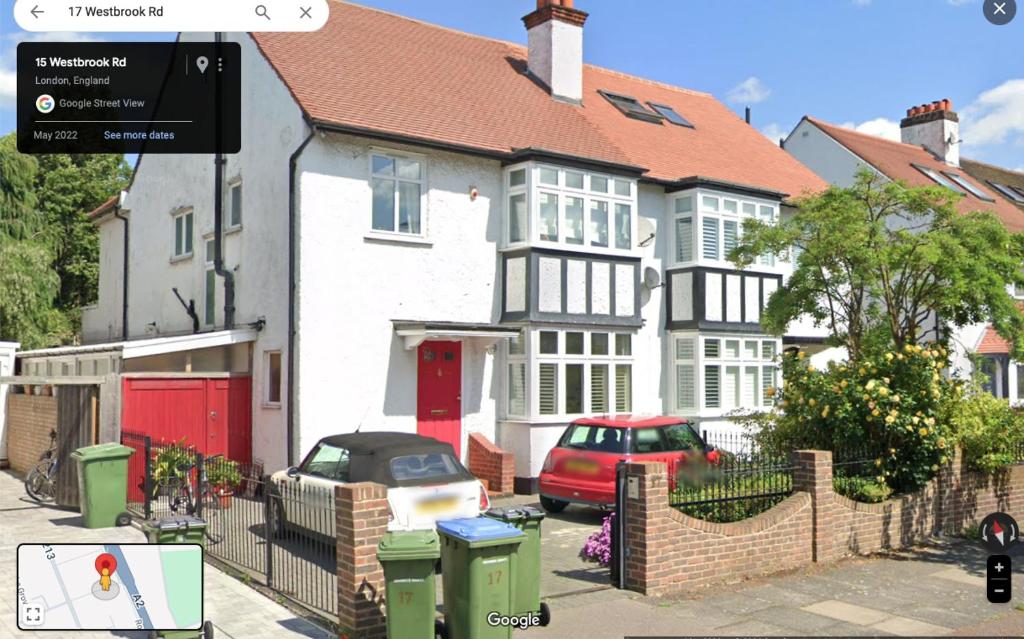 a house with a red car parked in front of it at Greenwich house in London