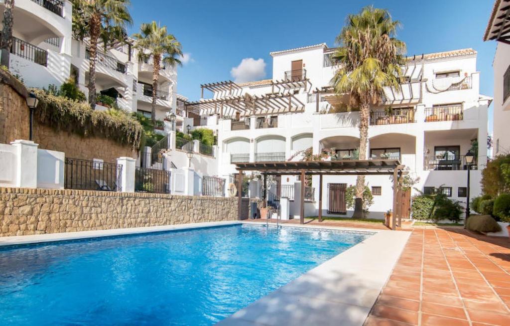 een zwembad voor een gebouw bij 2-story Penthouse with Beautiful Views in Marbella