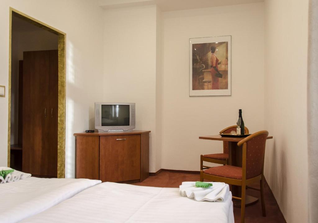 Postel nebo postele na pokoji v ubytování Penzion Hacienda Ranchero