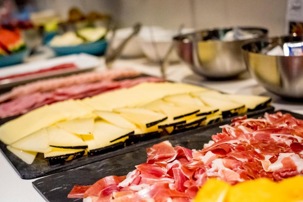 two slices of cheese and ham on a table at Zenit Valencia in Valencia