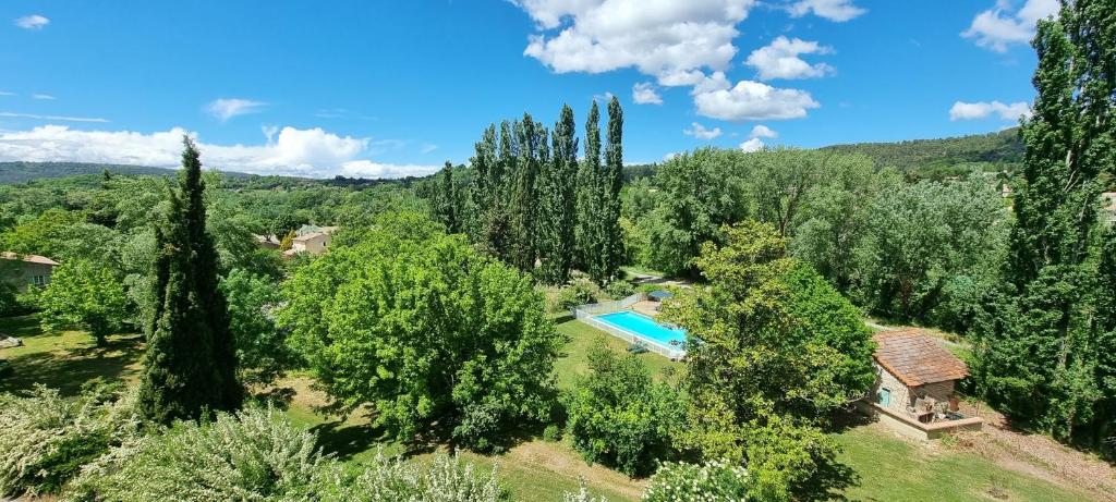 an aerial view of a villa with a swimming pool and trees at Logis Hôtels Le Saint Marc in Mollans-sur-Ouvèze