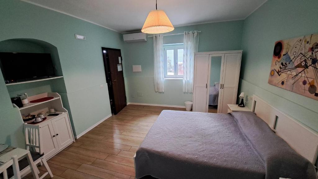 Postel nebo postele na pokoji v ubytování Altomuro 39 di S.A.