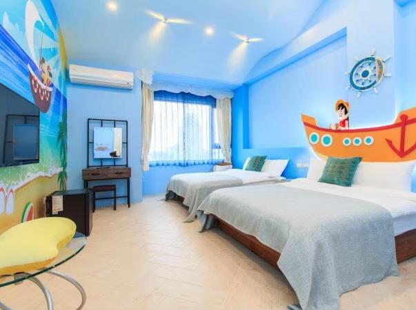 a bedroom with two beds and a boat on the wall at Elegance House in Wujie