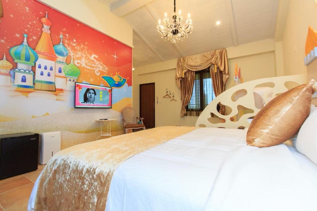 a bedroom with a large bed with a castle on the wall at Elegance House in Wujie
