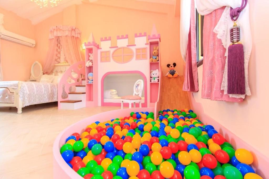 a play room with a large ball pit at Elegance House in Wujie