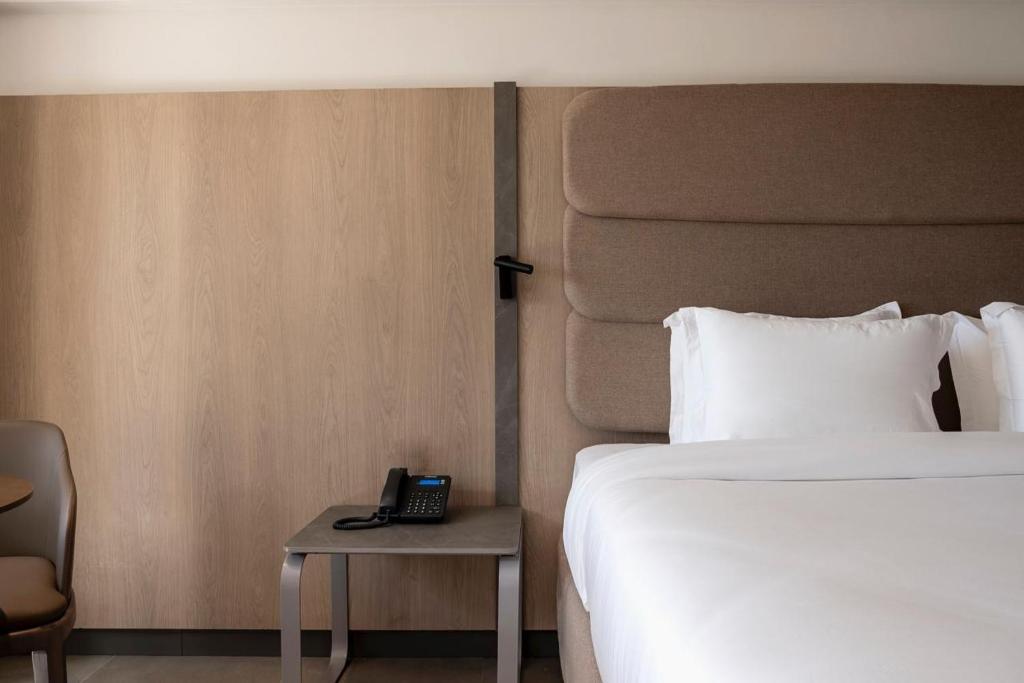 Cama ou camas em um quarto em HCM - Hotel Corais de Manaira