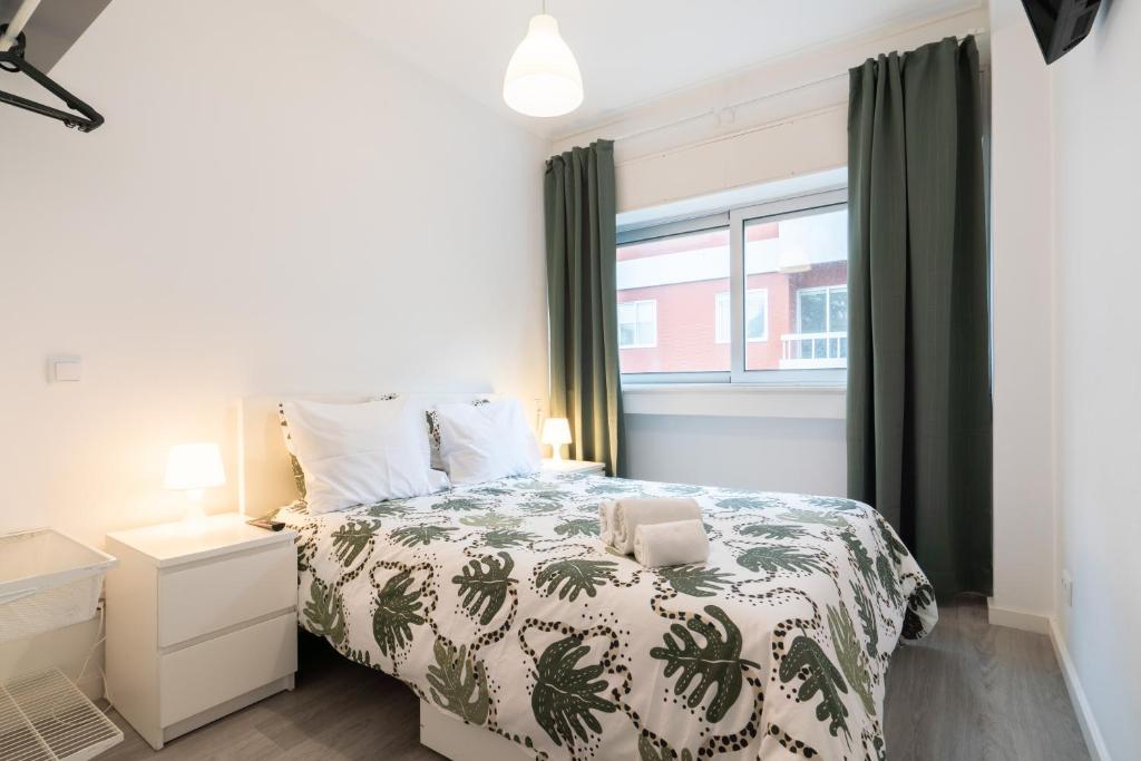 Ένα ή περισσότερα κρεβάτια σε δωμάτιο στο Moreira Terrace