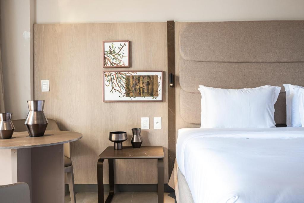 Cama ou camas em um quarto em HCM - Hotel Corais de Manaira