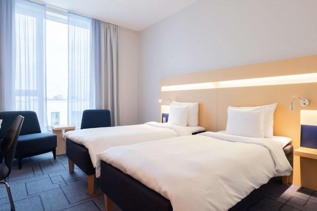 Postel nebo postele na pokoji v ubytování Best Western Plus Park City Malmö