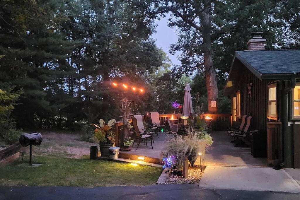 a backyard with a patio with lights and a house at Home away from home. in Wisconsin Dells