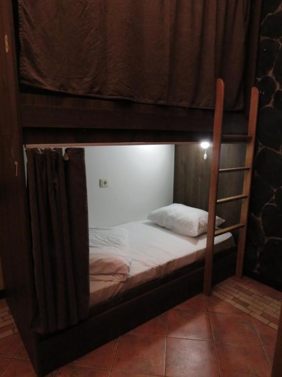 Postel nebo postele na pokoji v ubytování Hostel Jan in the very center