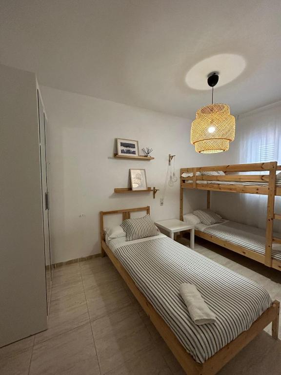 Postel nebo postele na pokoji v ubytování APARTAMENTO PEÑISCOLA